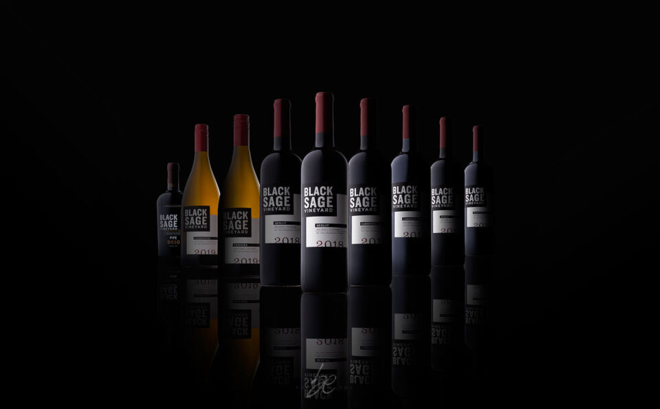 bottle lineup of black sage vineyard wines in studio by kelowna photographer brandon elliot